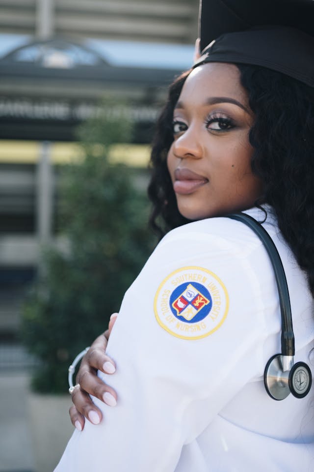 woman wearing white long sleeved shirt and stethoscope