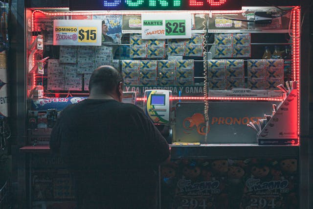 photo of man buying a lottery voucher